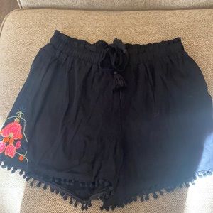 Black shorts with tassels and floral size small